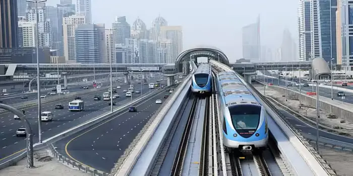 Dubai Metro Green Line train at Union Station showing timings for commuters and tourists