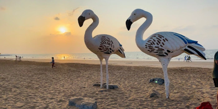 Flamingo Beach Ras Al Khaimah UAE with calm turquoise waters, sandy shoreline, and scenic sunset